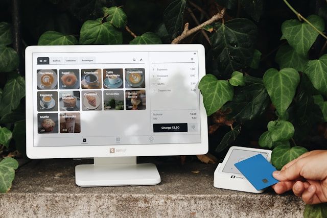 Person shopping online with packages in background